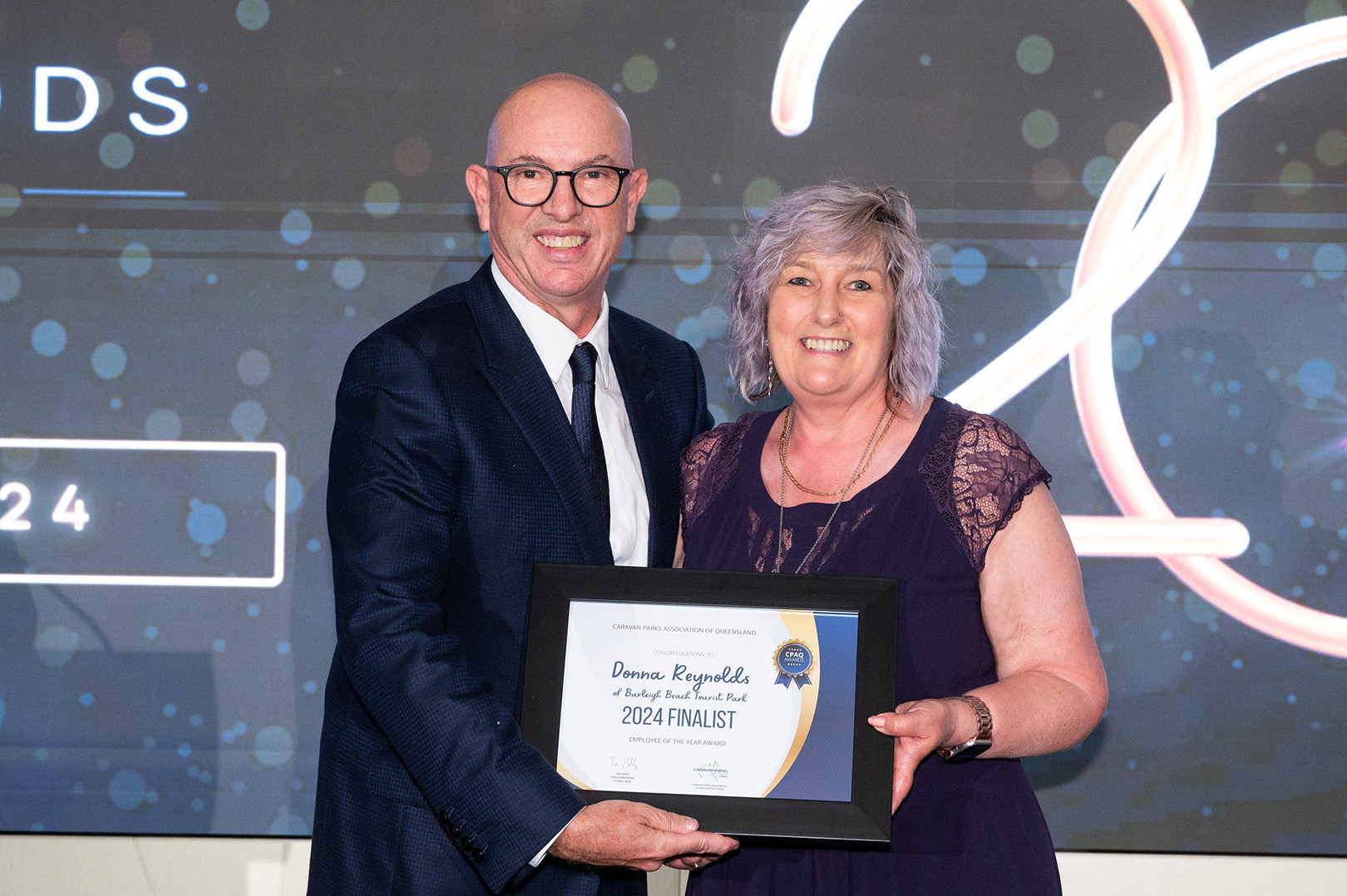 Donna Reynolds of Burleigh Beach Tourist Park accepting her award for Employee of the Year at the 2024 CPAQ Awards.