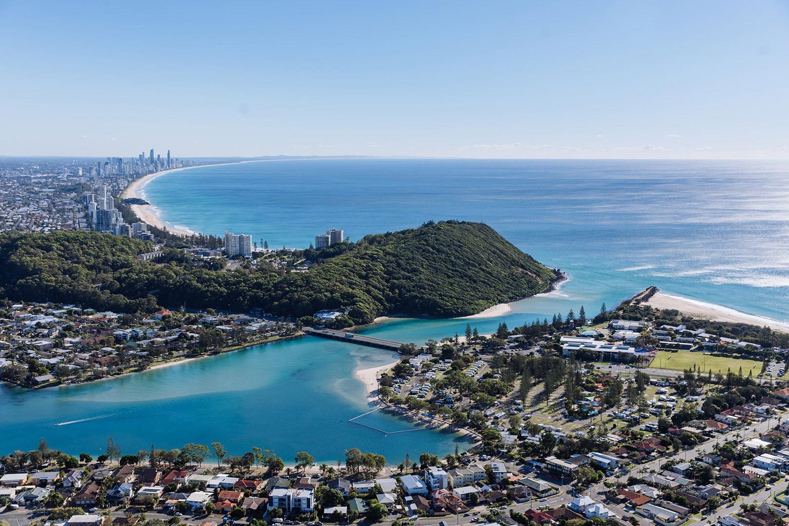 Aerial image of Tallebudgera Creek and Burleigh Headland, with Surfers Paradise in the background.