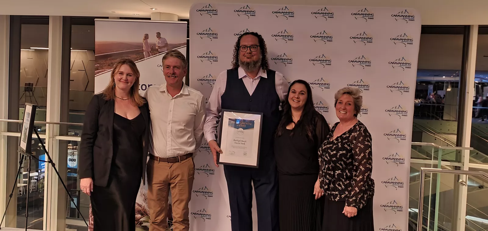 The Burleigh Beach Tourist Park Team with their award at the 2023 CPAQ Awards night.