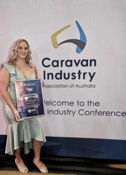 Brooke Turner of Broadwater Tourist Park posing with her finalist award in the Future Leaders category.